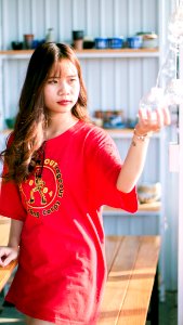 Woman Wearing Red Crew-neck Shirt photo
