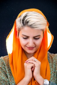 Woman Wearing Orange Hijab Headdress photo