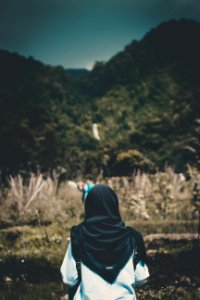 Shallow Focus Photography Of Person In White Top And Headdress