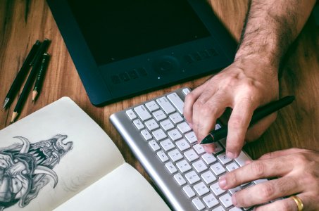 Person Using Magic Keyboard
