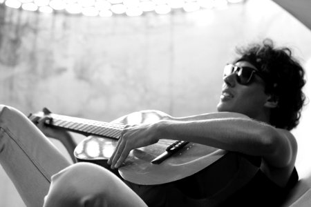 Grayscale Photo Of Man Playing Guitar photo