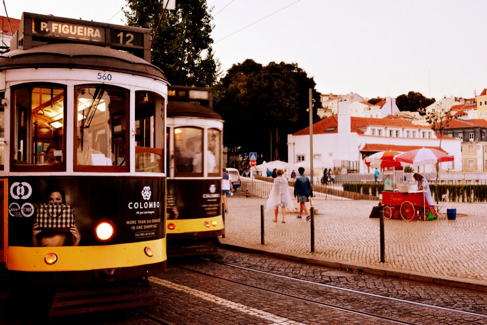 Two Black-and-yellow Trains At Daytime