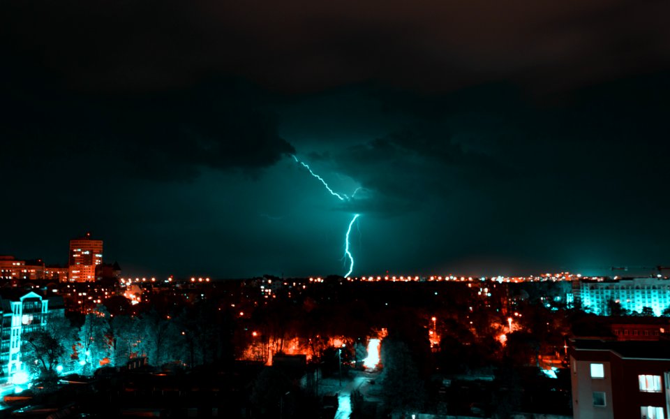 Aerial View Of City With Thunder