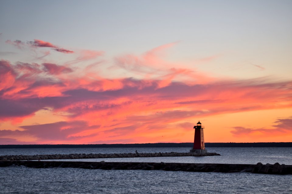 Lighthouse Surrounded By Body Of Water