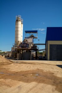 Two Gray Metal Water Tanks Near Building photo