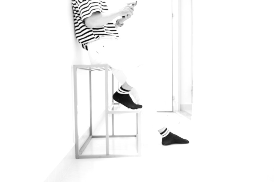 Person Wearing White Pants And Black Socks