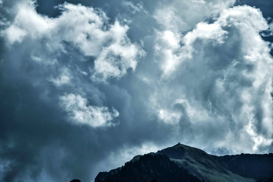 Photo Of Cloudy Sky Under Mountain