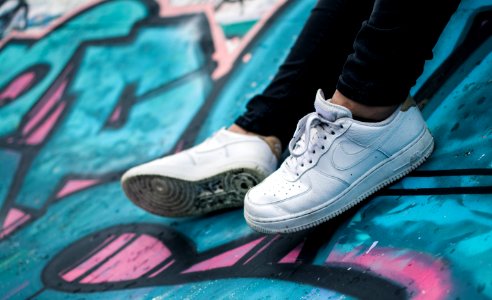 Person Wearing Pair Of White Nike Air Sneakers
