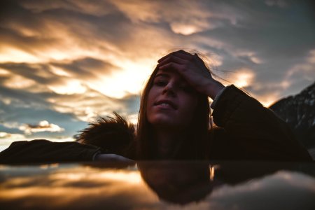 Woman Wearing Brown And Green Parka At Golden Hour