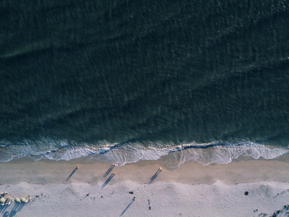 Gray Sand Near Body Of Water photo