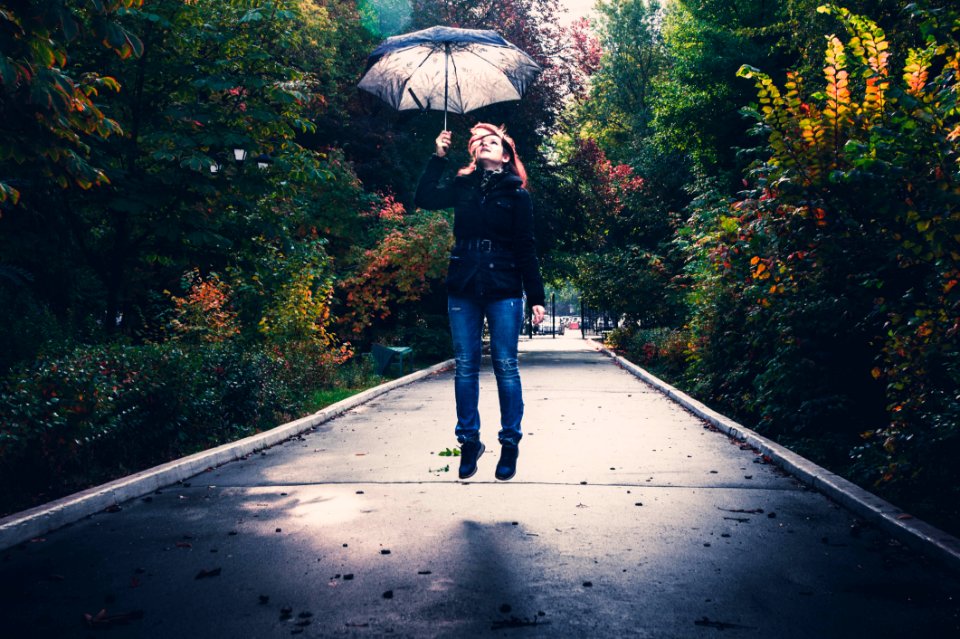 Woman Holding Gray Umbrella