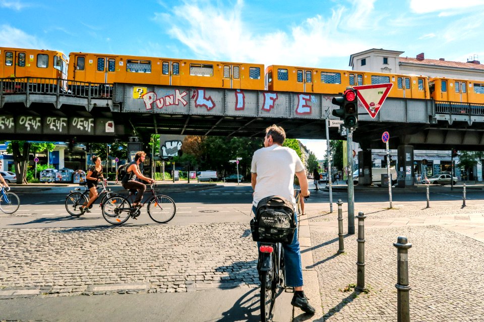 Man Stop As The Two Cyclist Passes By Near Train