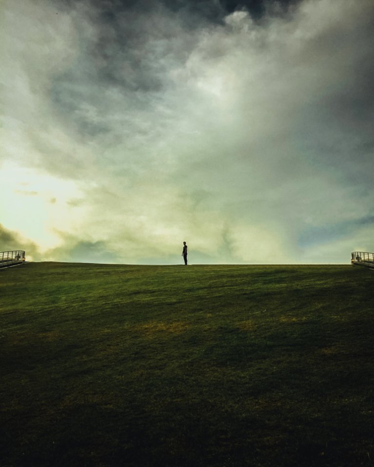 Person On Green Grass Field