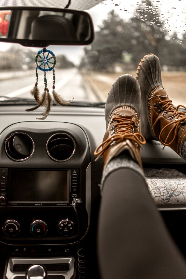 Person Wearing Duck Boots Inside Vehicle