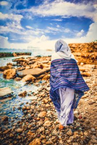 Person Standing On Seashore photo