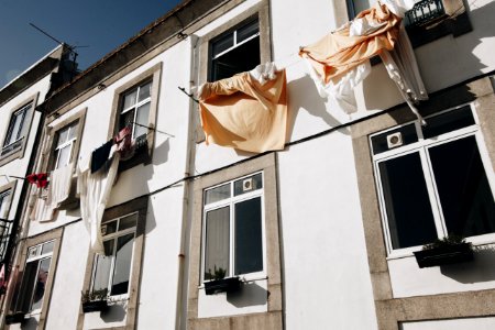 Clothes Hanged On Wire Beside House