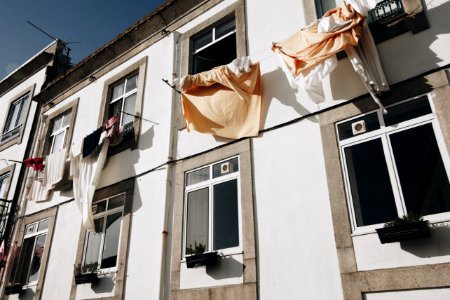 Clothes Hanged On Wire Beside House photo