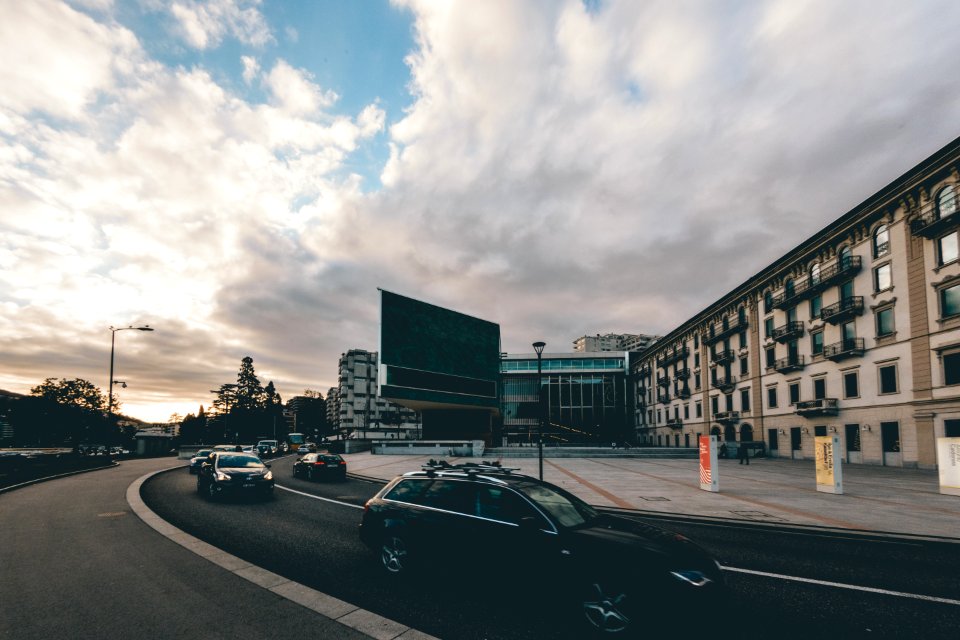 Black Car Near Concrete Building