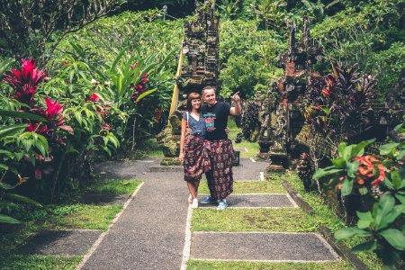 Woman And Man Standing Together And Looking On Flower Garden photo