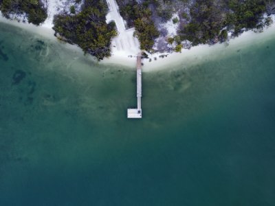 Aerial Photography Of Dock On Body Of Water photo