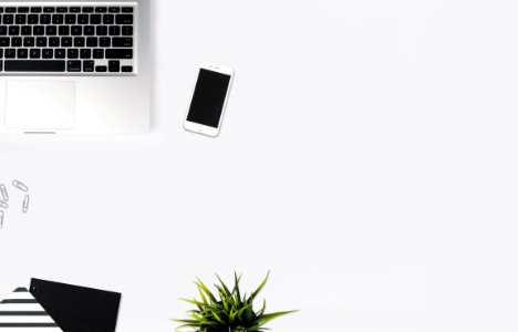 White Smartphone Beside Silver Laptop Computer photo