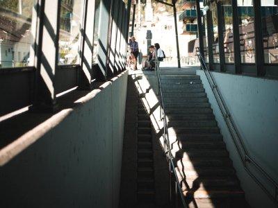 People Sitting On Bench Near Staircase photo
