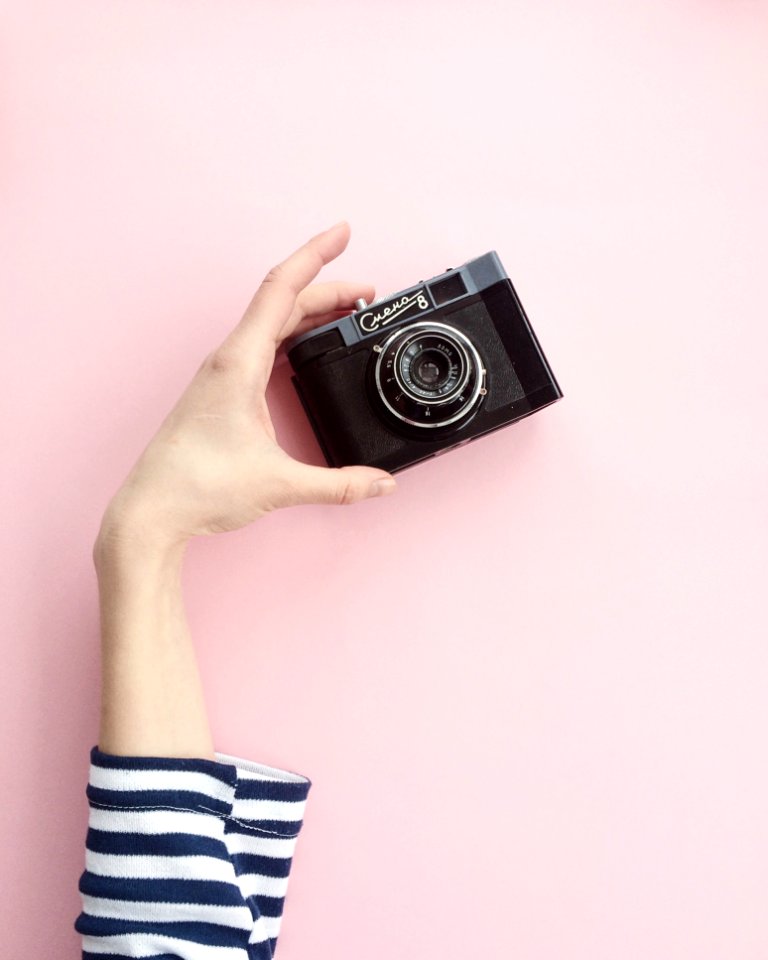 Person Holding Black Point-and-shoot Camera