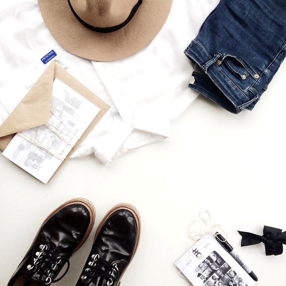 White Dress Shirt Near Blue Jeans And Envelope On Table