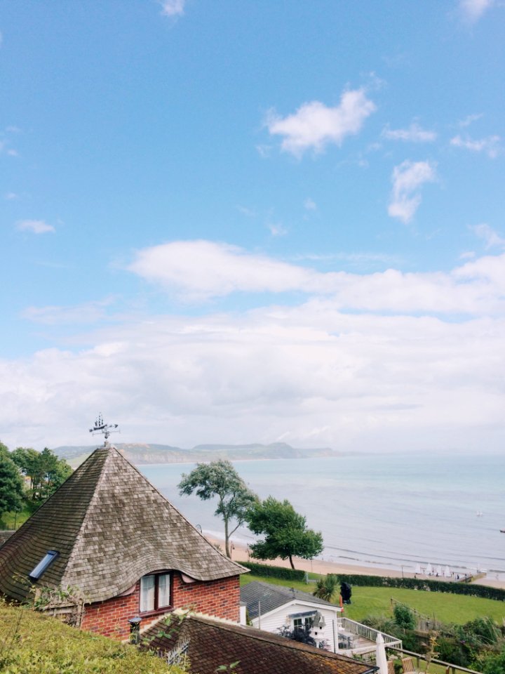 Photo Of Brown And Gray Concrete House Near Shore