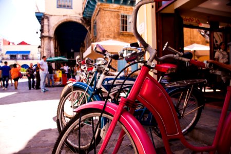Red Beach Cruiser Bicycle Across Concrete Building