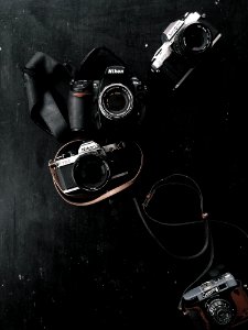 Three Black And Gray Dslr And Slr Cameras