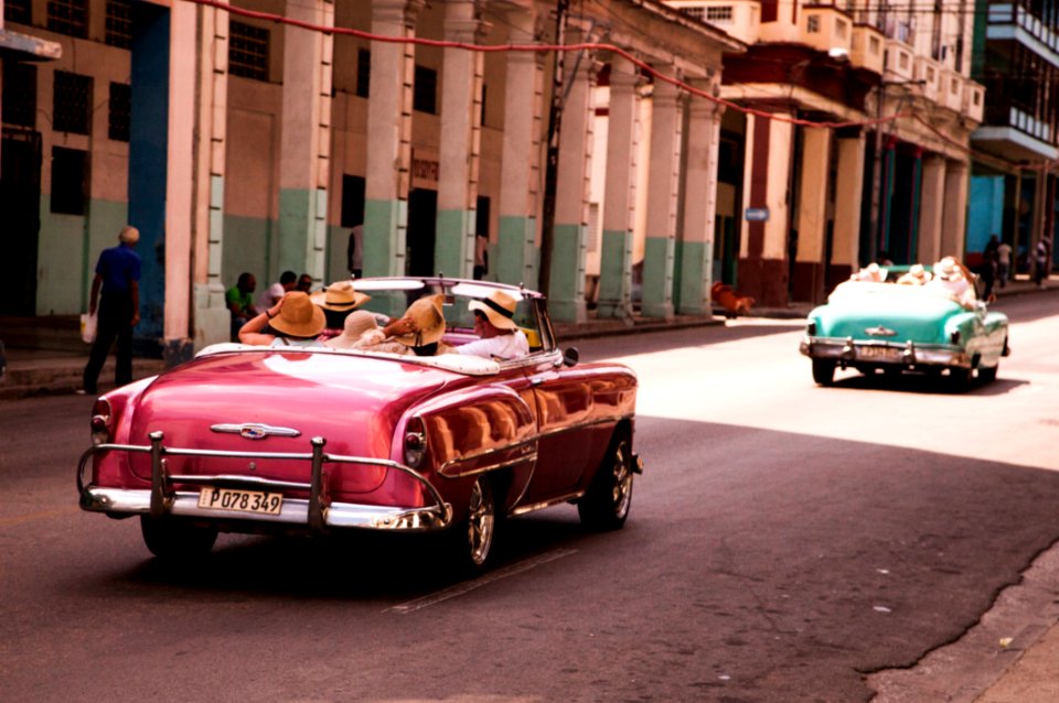 Girls Riding On Red Convertible Coupe