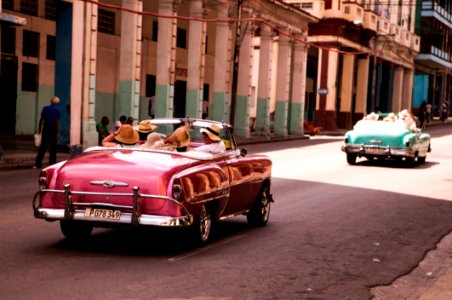 Girls Riding On Red Convertible Coupe