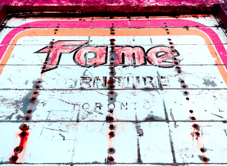 White And Pink Fame Signage