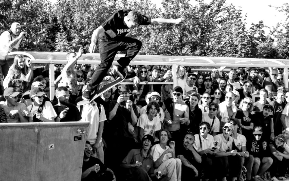 Grayscale Photography Of Man Doing Ollie