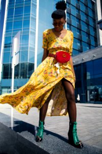 Woman Wearing Yellow Floral V-neck Long Dress And Pair Of Green Wedge Sandals
