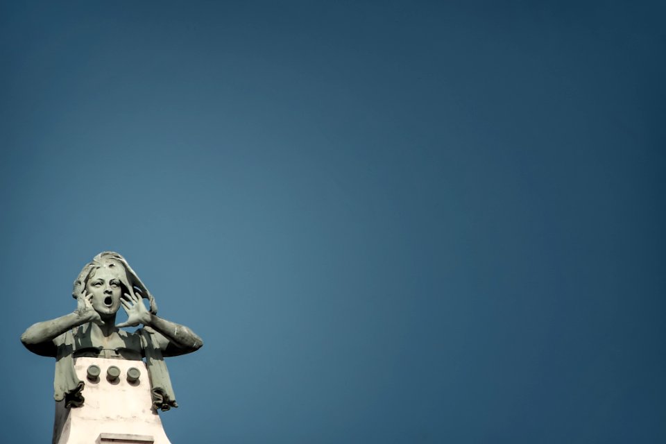 Photo Of Gray Howling Woman Statue