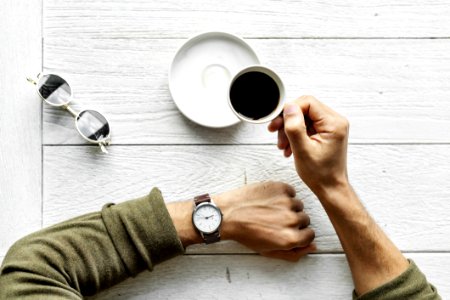 Person Holding Teacup photo