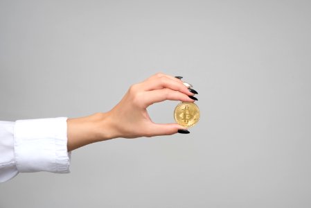 Woman Holding A Bitcoin photo