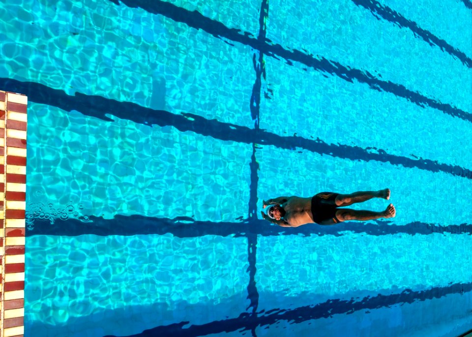 Person Diving On Swimming Pool