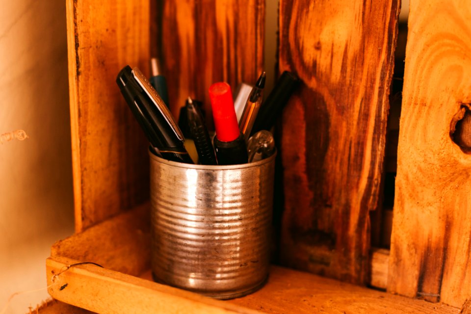 Selective Focus Photography Of Pens In Silver Can