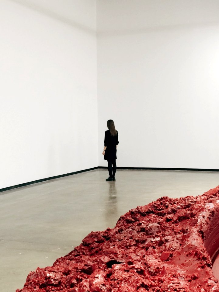 Woman Wearing Black Elbow-sleeved Top Standing On Gray Concrete Floor photo