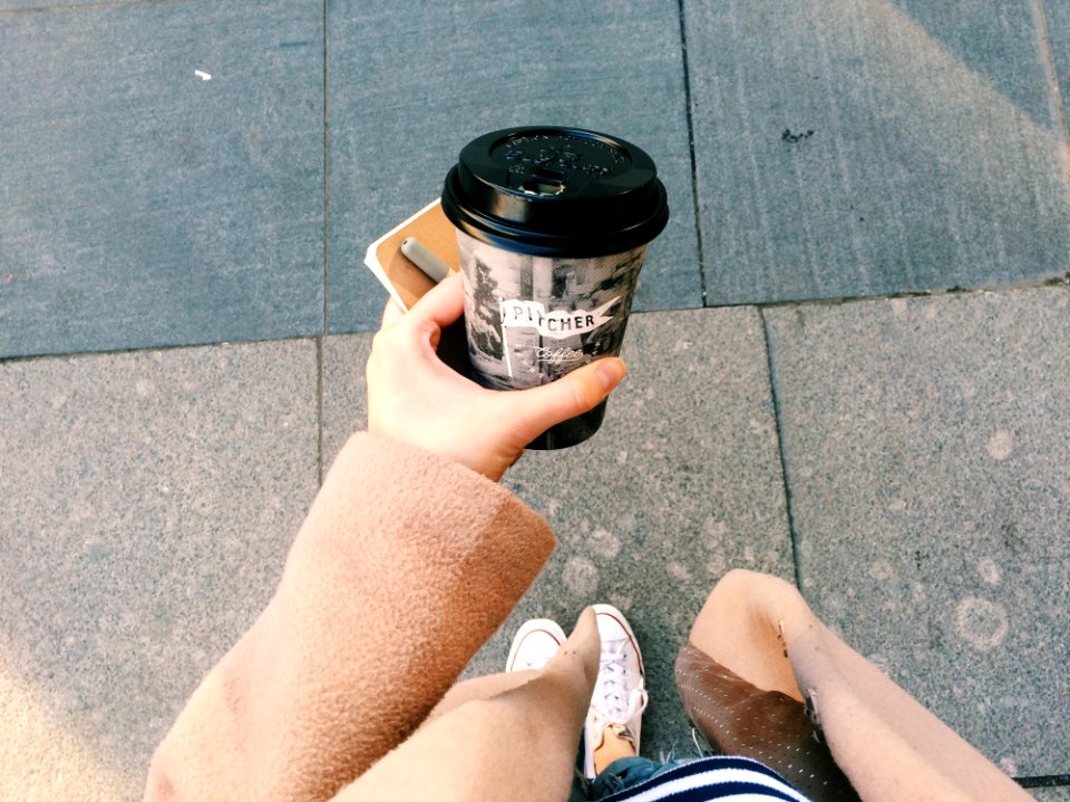 Person Holding Gray Disposable Cup