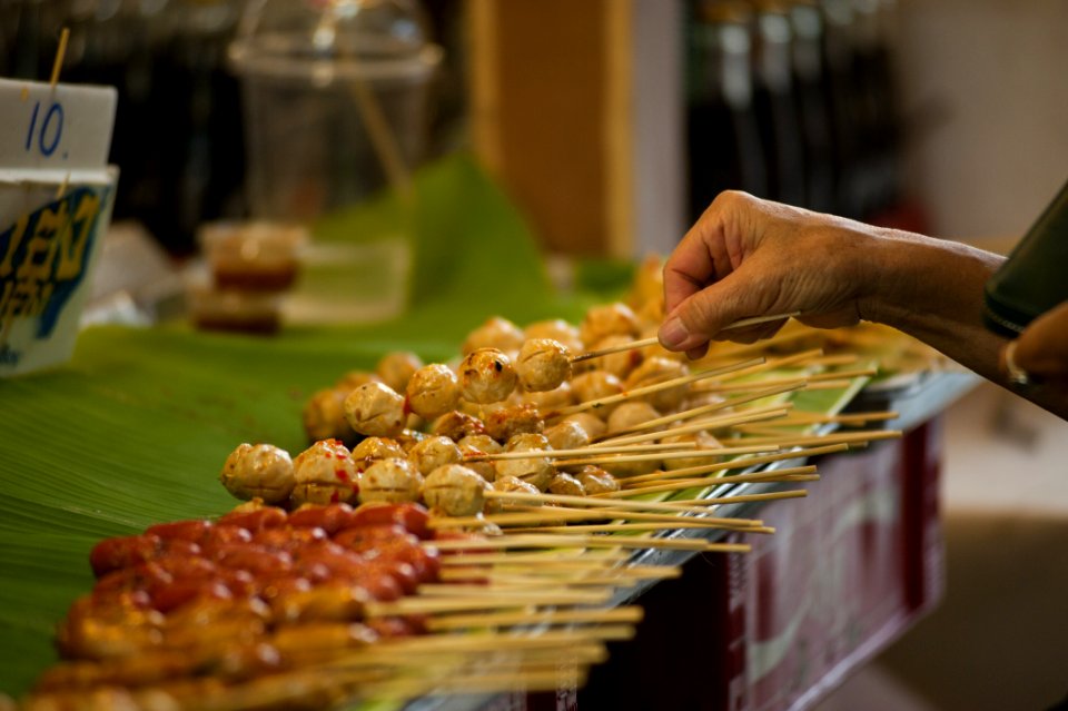 Tilt Shift Photography Of Street Foods In Stick