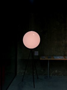 Round Pedestal Mirror Beside Brown Table