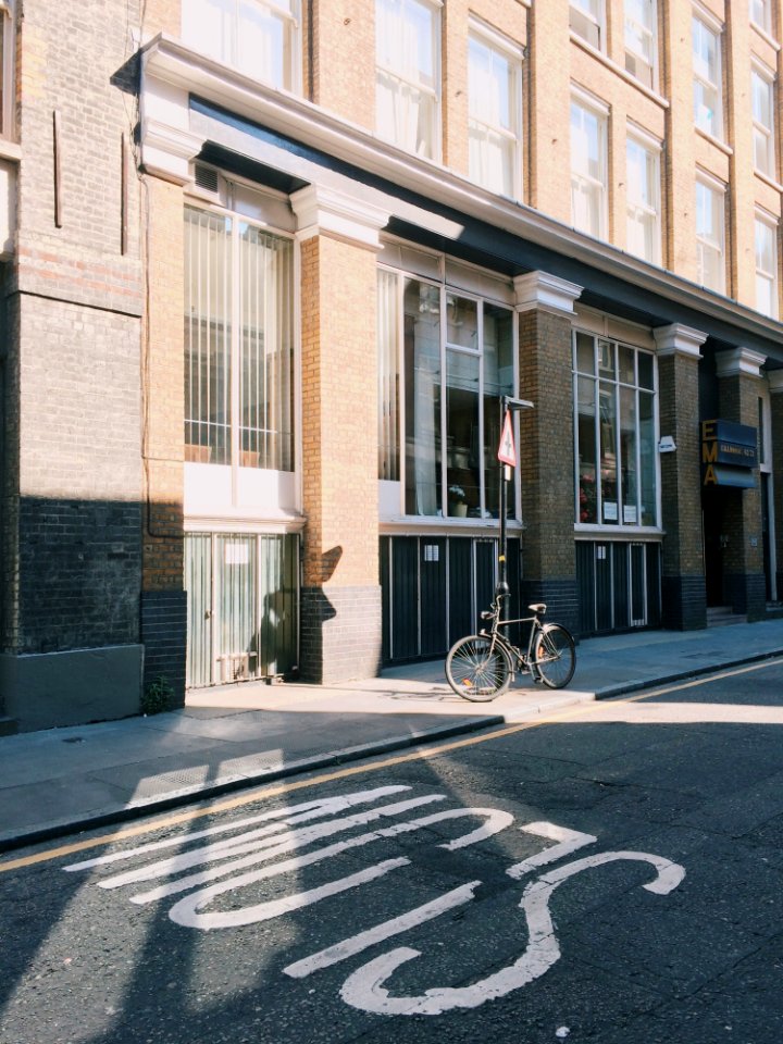 Black City Bicycle In Front Of Building photo