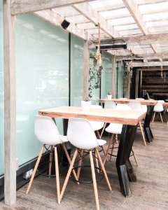 Two Table With Eight Chairs Inside Room