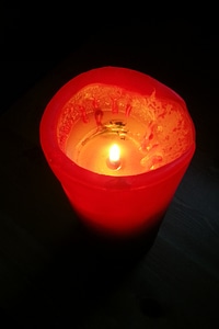 Light of a candle illuminated fire photo