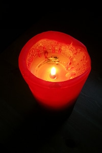 Light of a candle illuminated fire