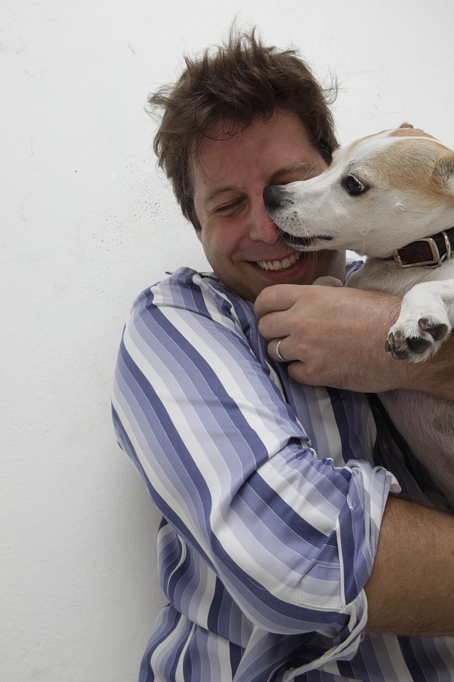 Man pet domestic animal